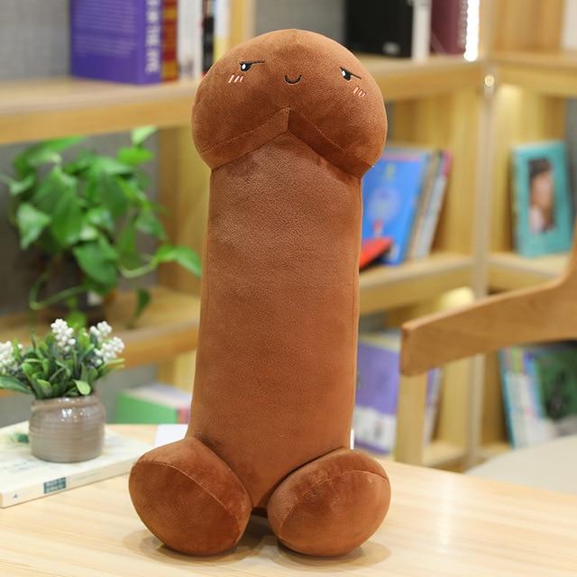 A cheeky expression on a black penis stuffie with three red streaks on cheeks