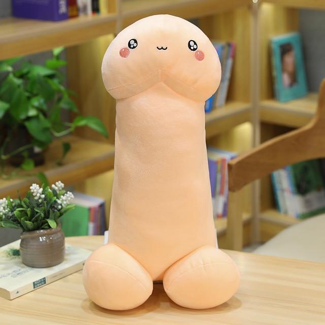 A cute pink penis with a cute expression on a table
