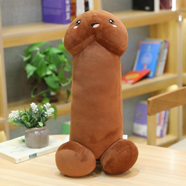 A stuffed pee pee that is laughing in expression in the color brown