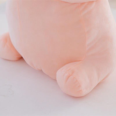 zoom in on the feet of the pink penis pillow, showing stitching and furriness